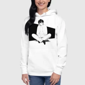 A woman wearing a white hoodie with a manga design of an anime boy sitting