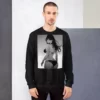 A man wearing a black sweatshirt with a manga design of an anime girl in bikini