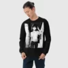 A man wearing a black sweatshirt with a manga design of an anime girl in the neighborhood