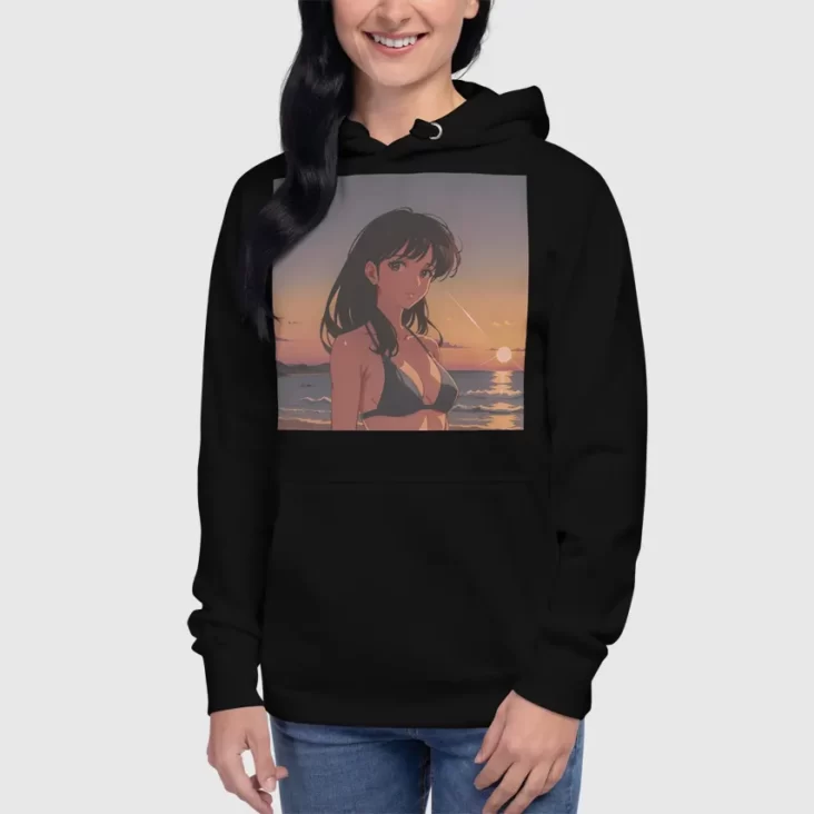 A woman wearing a black hoodie with a design of a 90s anime girl in the beach in a retro vintage style