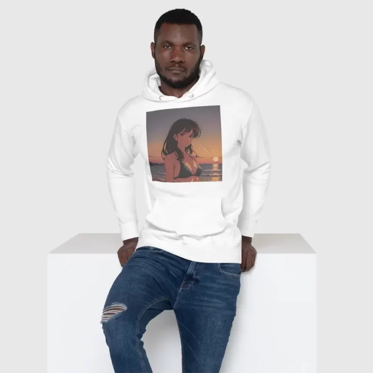 A man sitting on a white block wearing a white hoodie with a design of a 90s anime girl in the beach in a retro vintage style