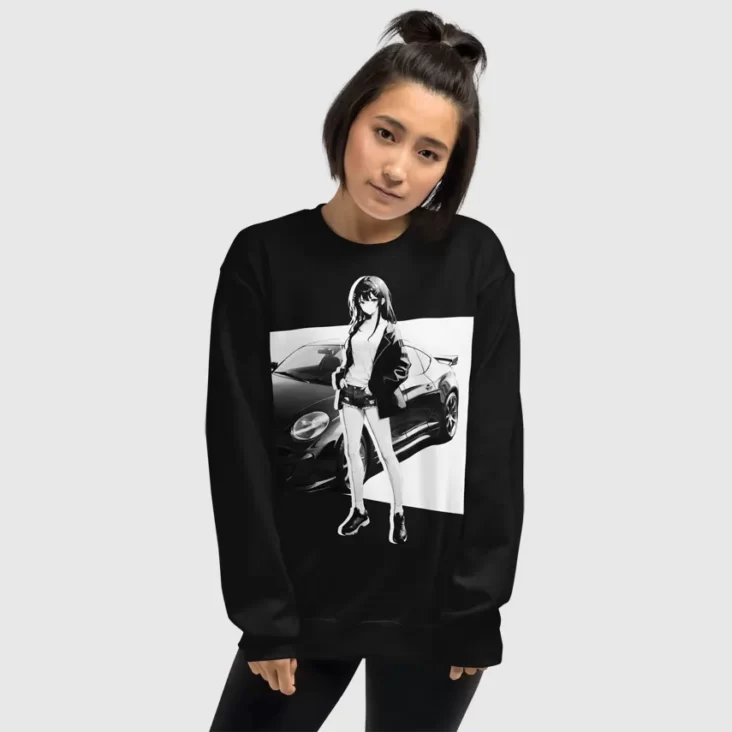 A woman wearing a black sweatshirt with a manga design of an anime girl and car