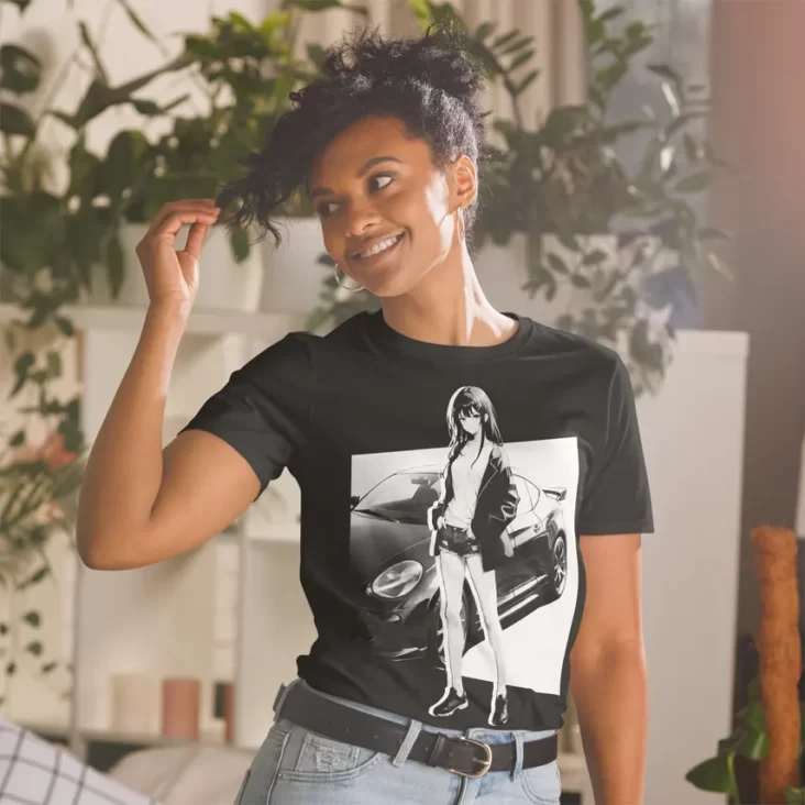 A woman with plants in the background wearing a black shirt with a manga design of an anime girl and car