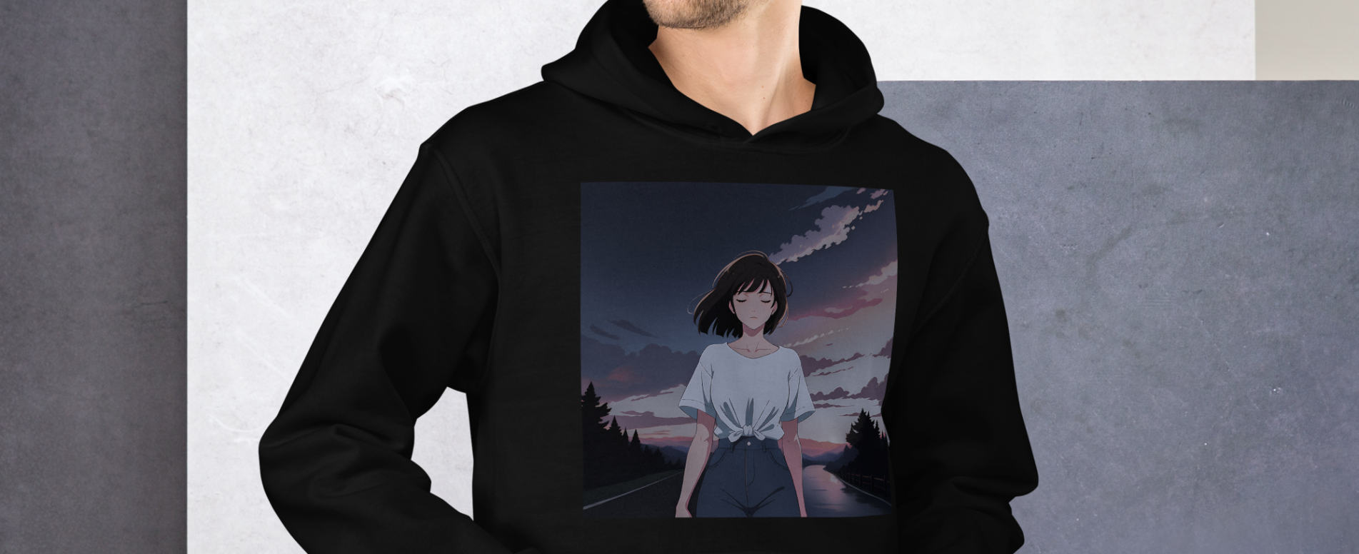 A man with his hands in his pockets wearing a black hoodie with a design of a 90s anime girl in the middle of the road in a retro vintage style