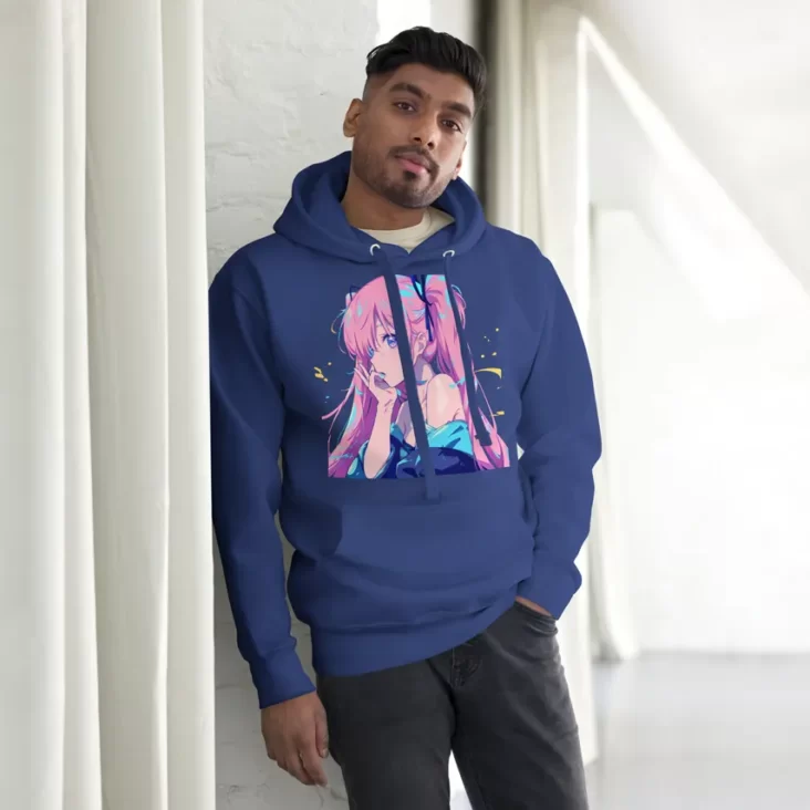 A man with his hand in his pocket wearing a blue hoodie with a design of a pink hair anime girl